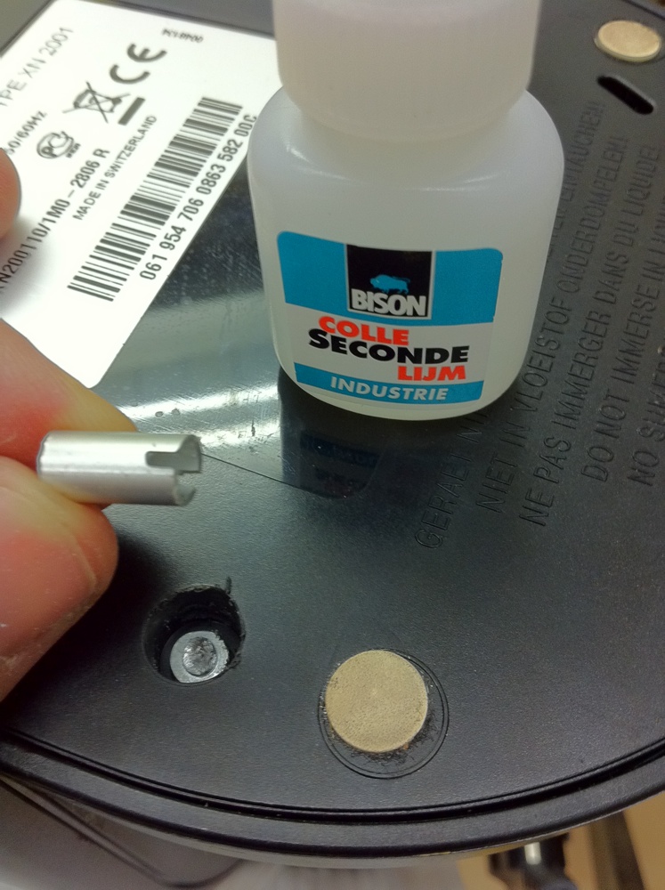 Super Glue and a bushing. Note the slot for the screwdriver.