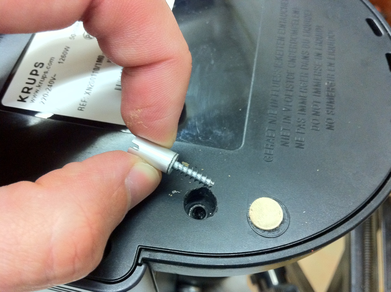 Removed screw with the bushing glued to it.